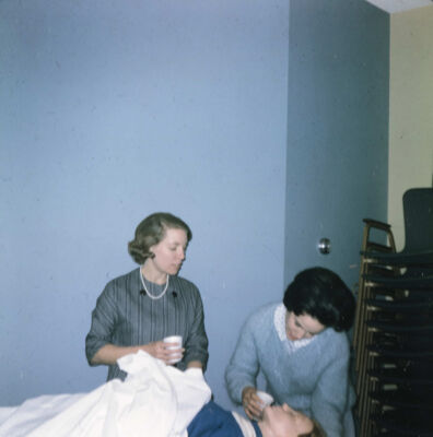 Barbie McCluer and Unidentified League Member With Rescue Annie Slide, March 1966
