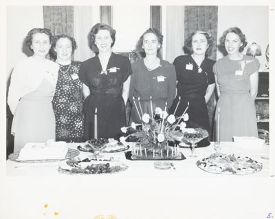 two gamma sigma chapter members with dates photograph, c. 1934 (image)