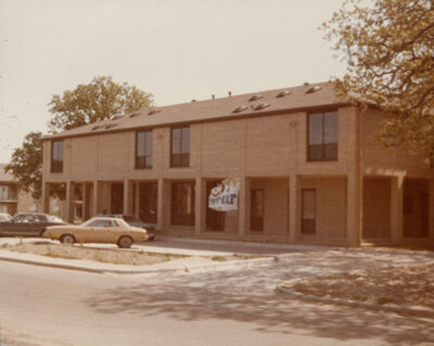epsilon rho chapter house with sheet sign photograph, 1982 (image)