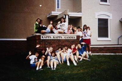 omicron deuteron chapter members in front of chapter house slide (image)
