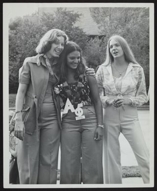 Two Omicron Chapter Members with New Member on Bid Day Photograph, 1975
