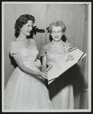 Marietta Lind Accepting Charter from Marian Keys Photograph, May 24, 1958
