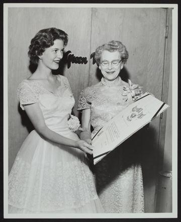 Marietta Lind Accepting Charter from Marian Keys Photograph, May 24, 1958