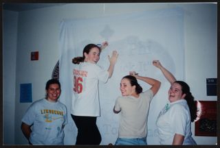 Theta Gamma Chapter Members Creating Sheet Sign Photograph, c. 1996