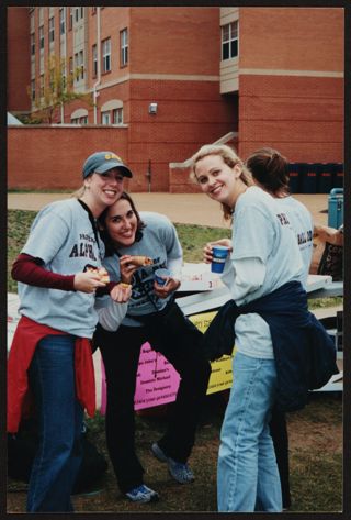 Zeta Upsilon Chapter Members Eating Pizza at Phi Ball Photograph