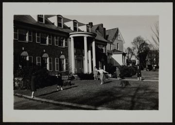 Rho Chapter Members Playing Ball Outside Chapter House Photograph, 1946-1947