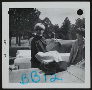 Two Beta Gamma Chapter Members Between Parked Cars at Flagstaff Mountain Photograph, October 1967