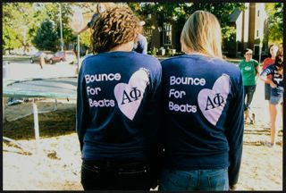 Two Epsilon Beta Chapter Members in Bounce for Beats T-Shirts Photograph 1