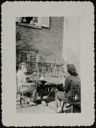 Two Unidentified Rho Chapter Members Sitting Outside of Chapter House Photograph, c. 1940s