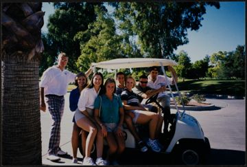 Four Beta Epsilon Chapter Members and Caddies at Alpha Phi Golf Classic Photograph, October 18, 1998