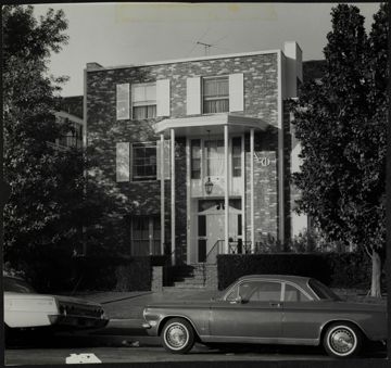 Beta Pi Chapter House with Cars Parked Outside Photograph