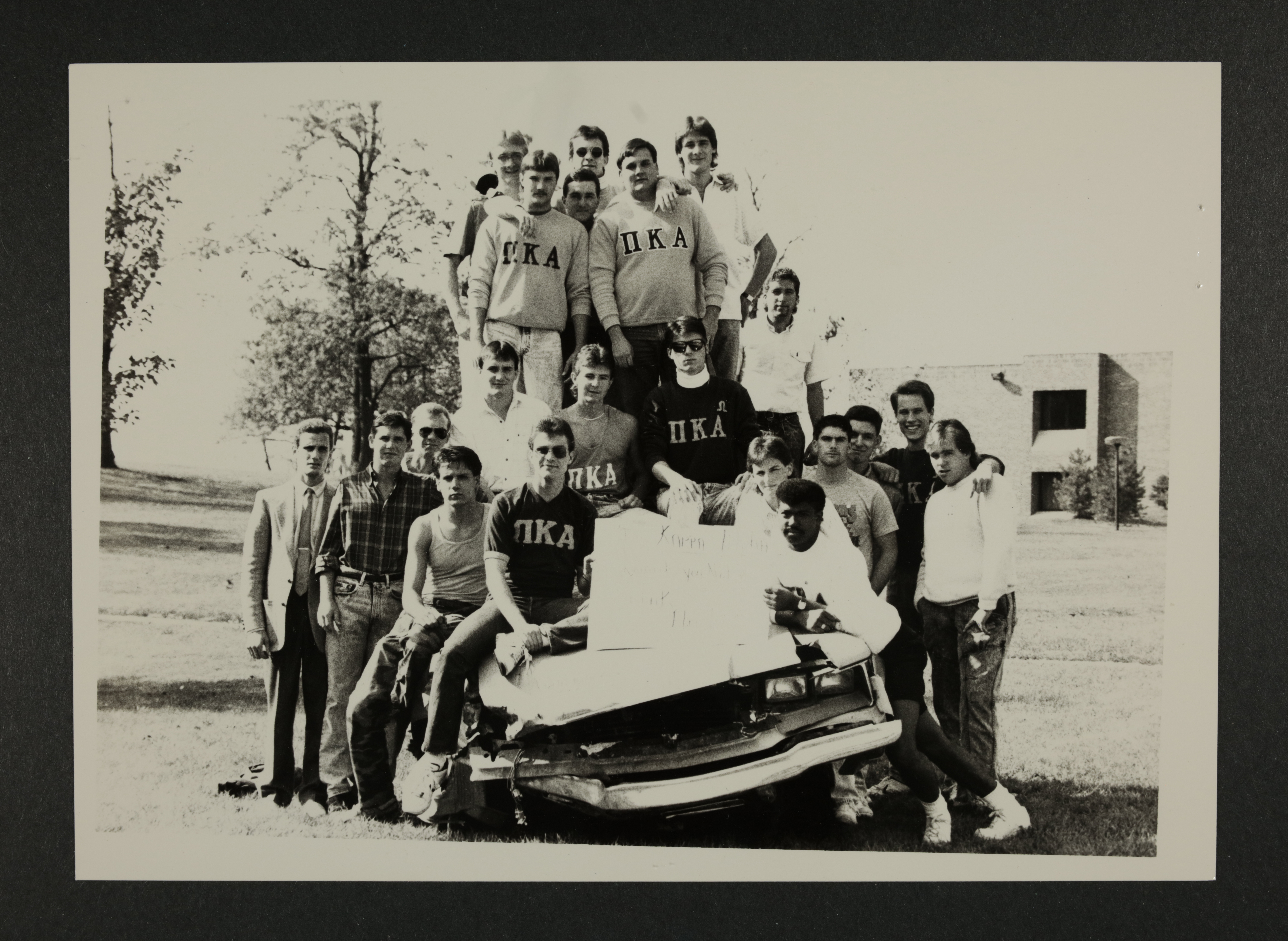 Theta Kappa Chapter Members With Old Car Photograph