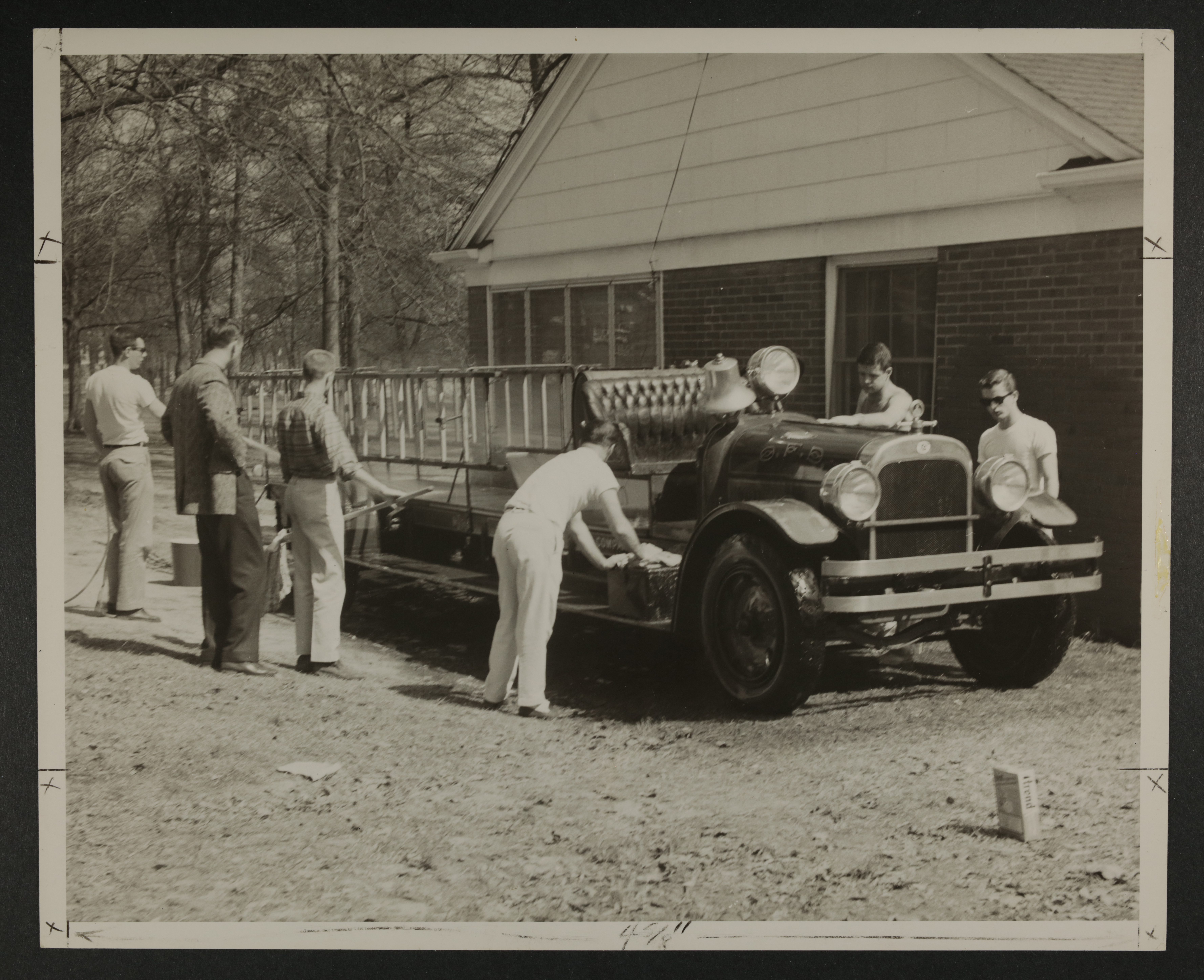 Nu Chapter Members Working on Fire Truck Photograph, June 1960