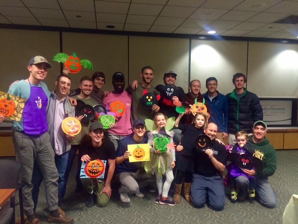 Lambda Delta Chapter Members Make Paper Jack O'Lanterns With Kids Photograph