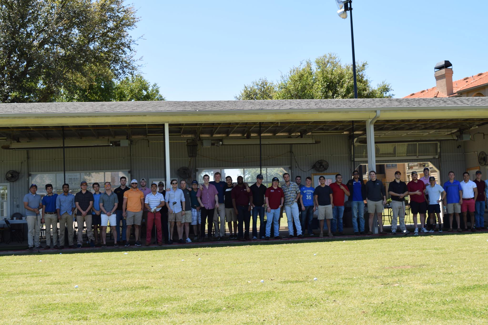 Eta Upsilon Chapter Members In A Garage Photograph