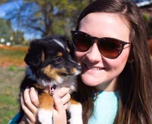An Unidentified Young Woman Holding A Puppy Photograph