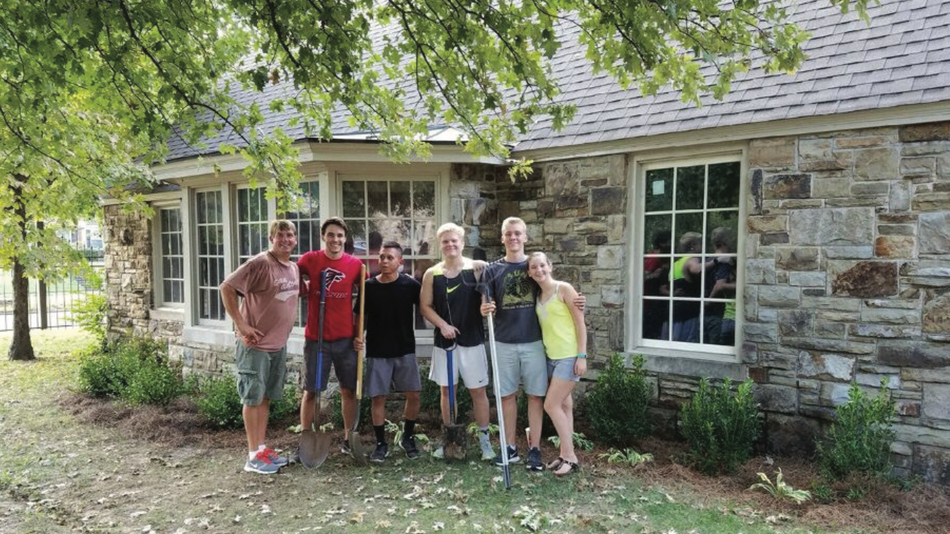 Five Theta Chapter Pikes and Unidentified Perform Yard Work Photograph