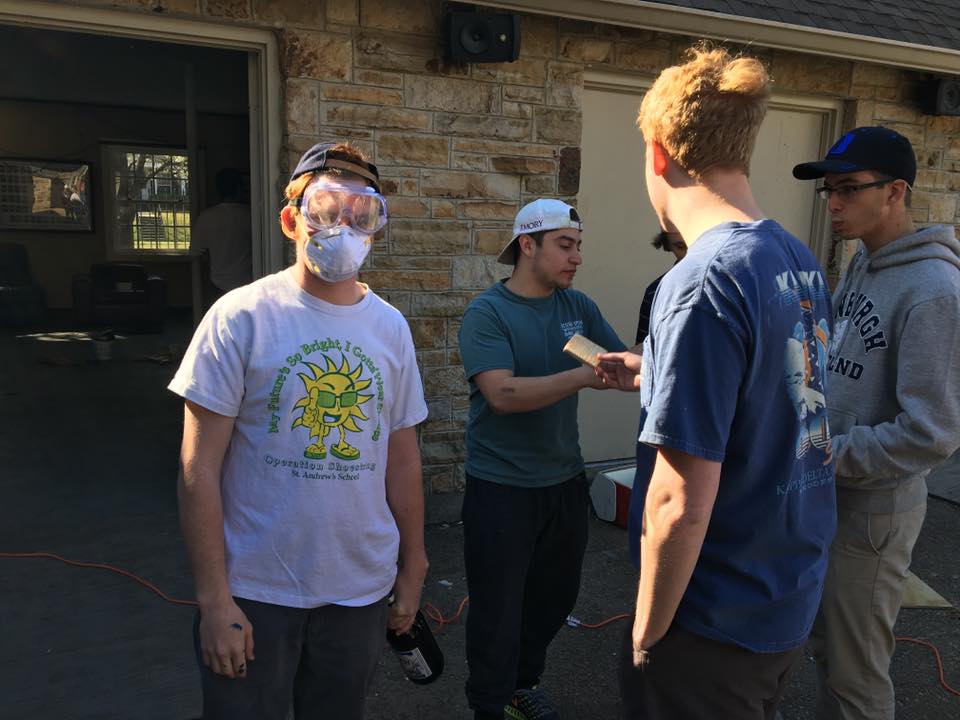 Four Theta Chapter Members Work On Their Chapter House Photograph