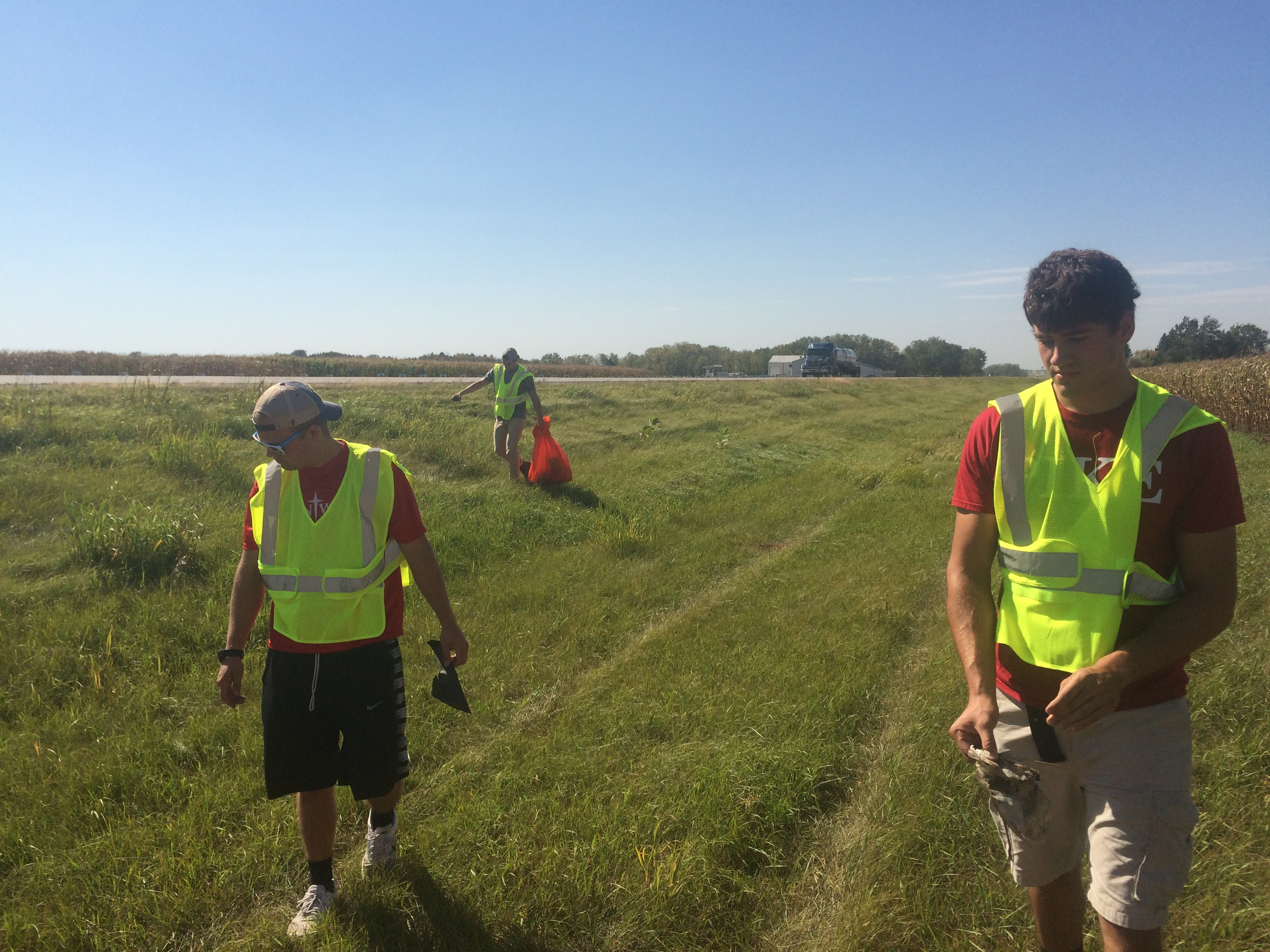 Three Mu Omicron Pikes Performing a Trash Clean Up Photograph