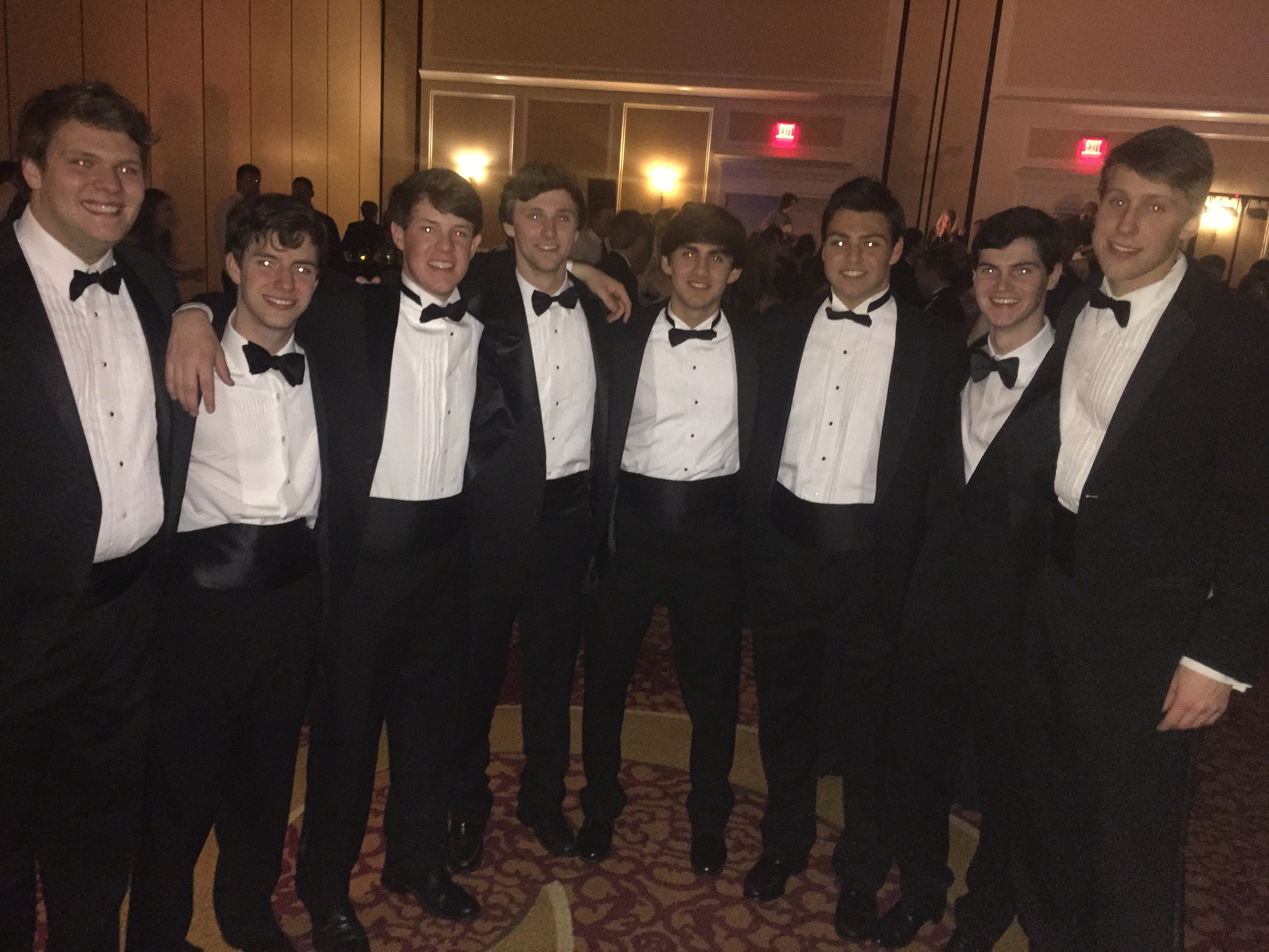 Eight Nu Chapter Members Wearing Suits and Bowties Photograph