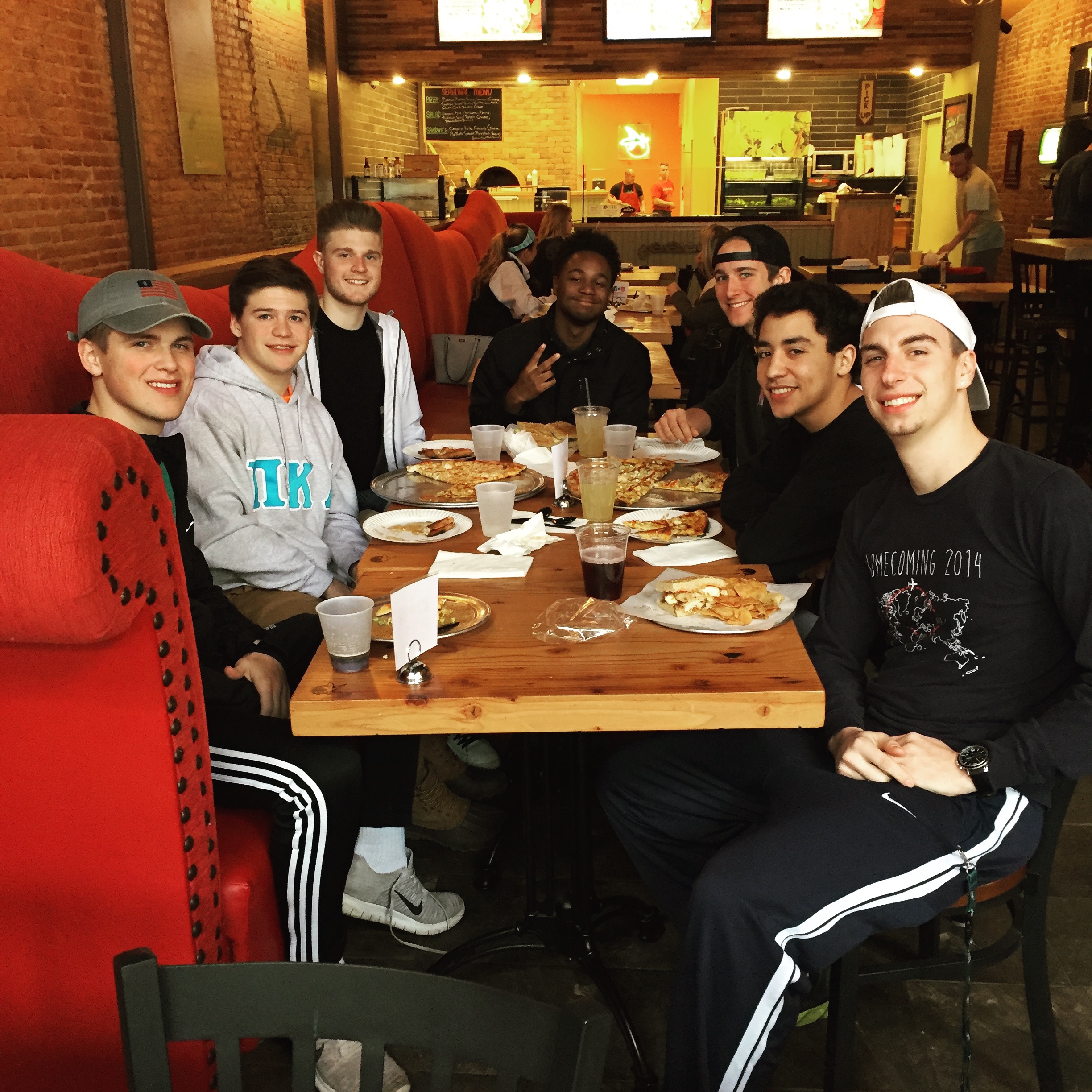 Seven Mu Lambda Chapter Members Eat At A Restaurant Photograph