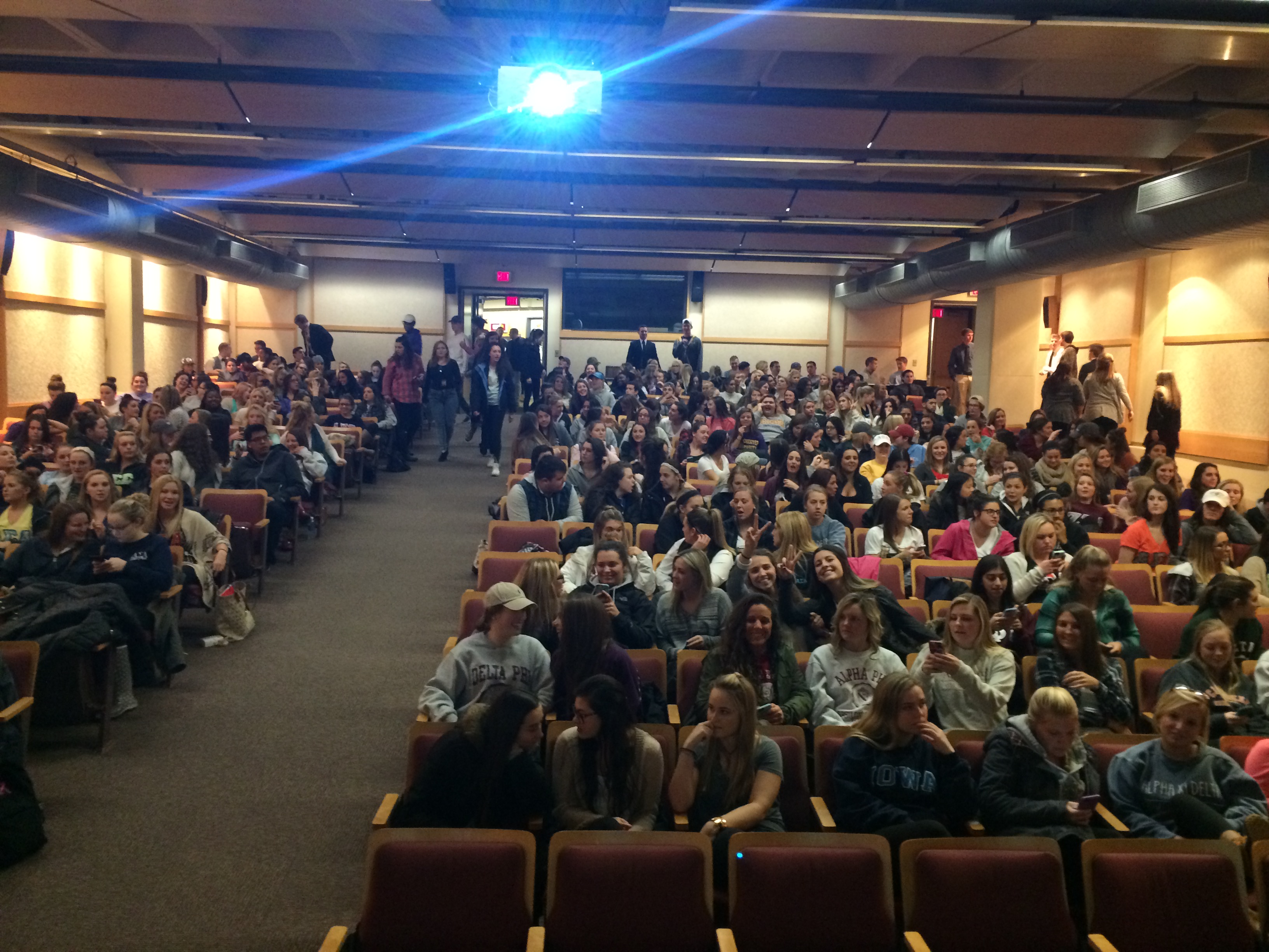 College Students Gather In A Presentation Hall Photograph