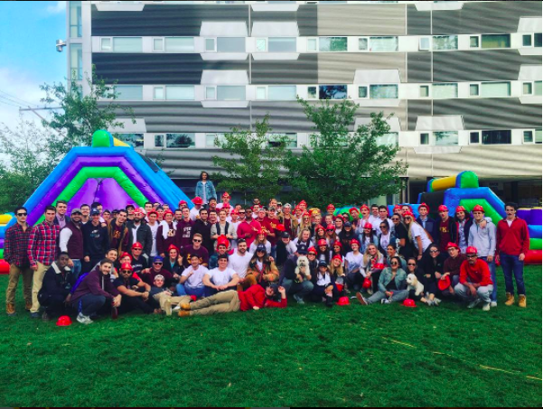 Lambda Zeta Pikes and Other Fraternity Members With An Inflatable Playground Photograph