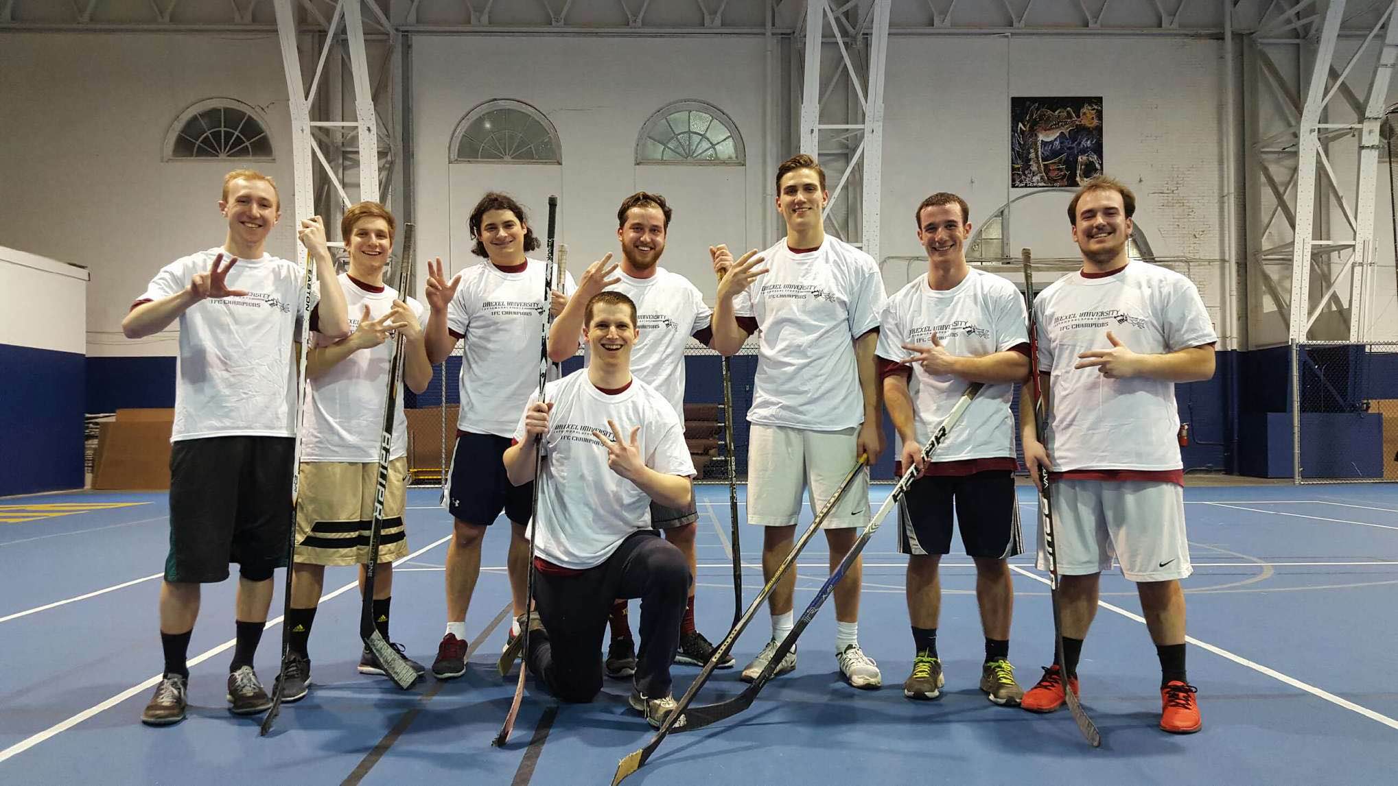 Eight Zeta Lambda Chapter Members Play Floor Hockey Photograph