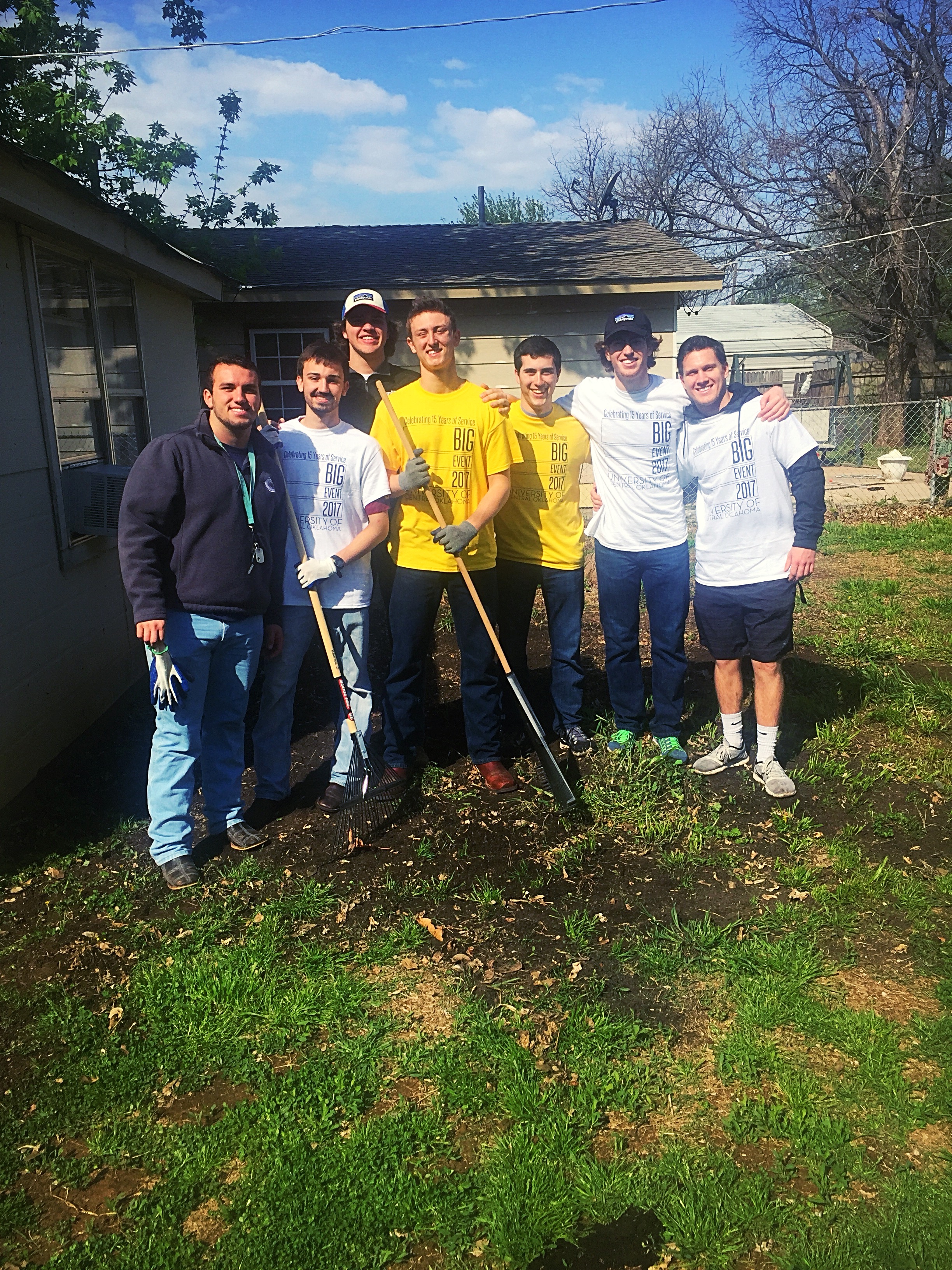 Seven Lambda Iota Chapter Members Do Yard Work Photograph