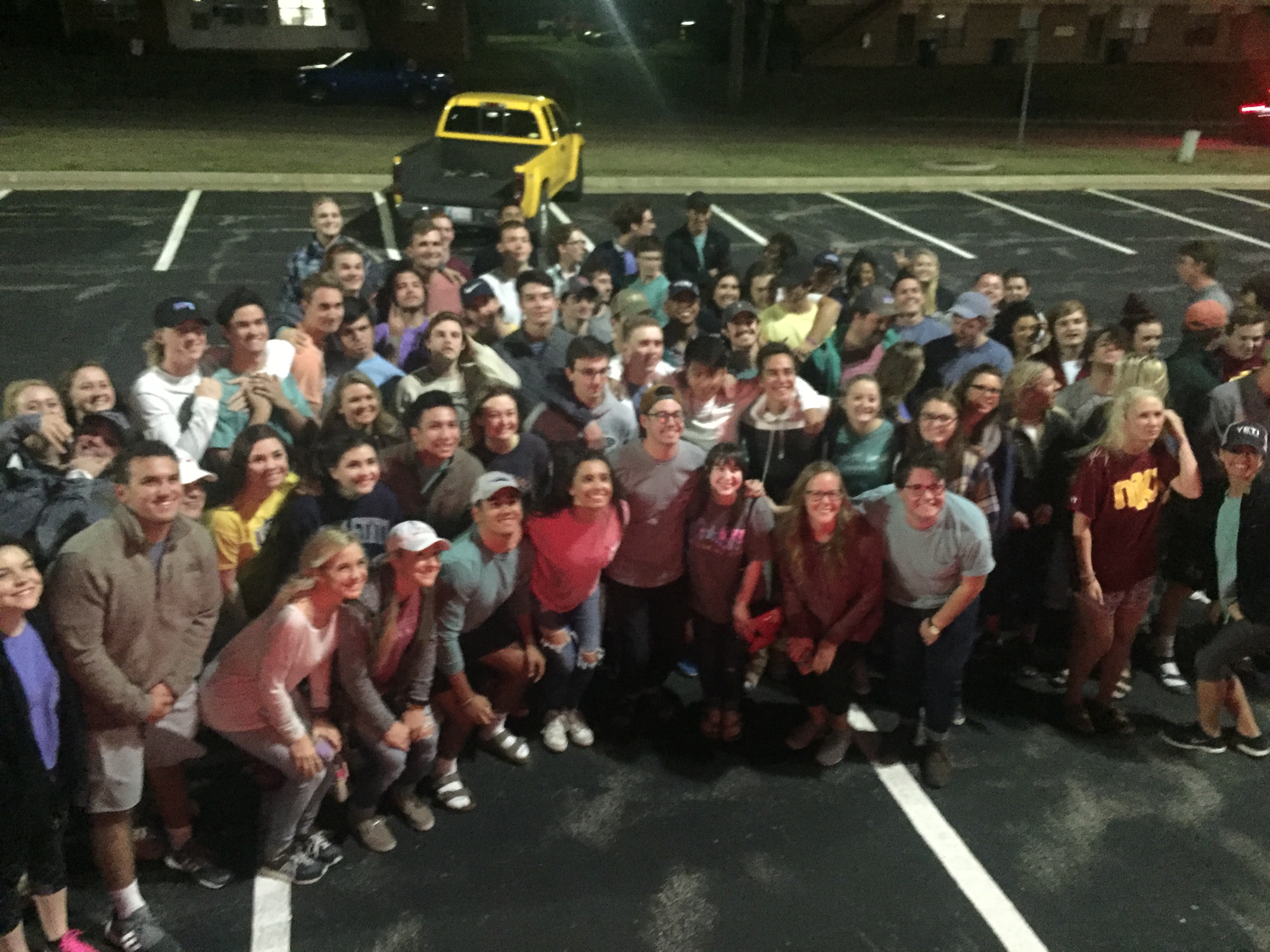 Lambda Iota Pikes and Other Students in a Parking Lot Photograph