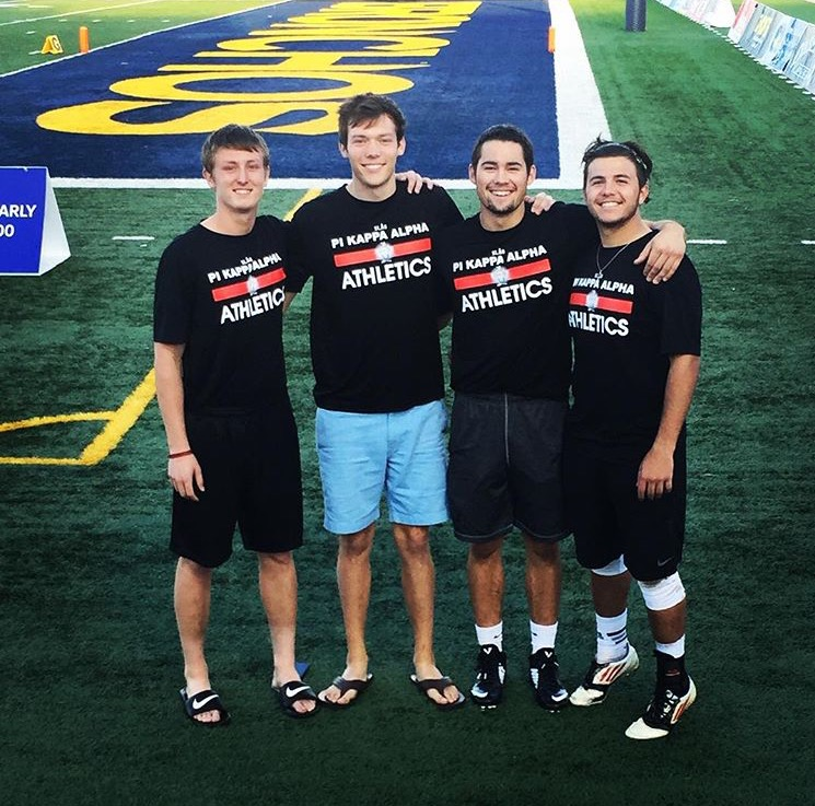 Four Lambda Iota Chapter Members Wearing PiKA Athletics T-Shirts Photograph
