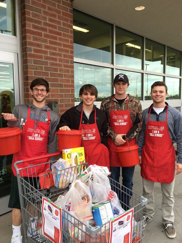 Four Iota Gamma Chapter Members Collect Donations Photograph