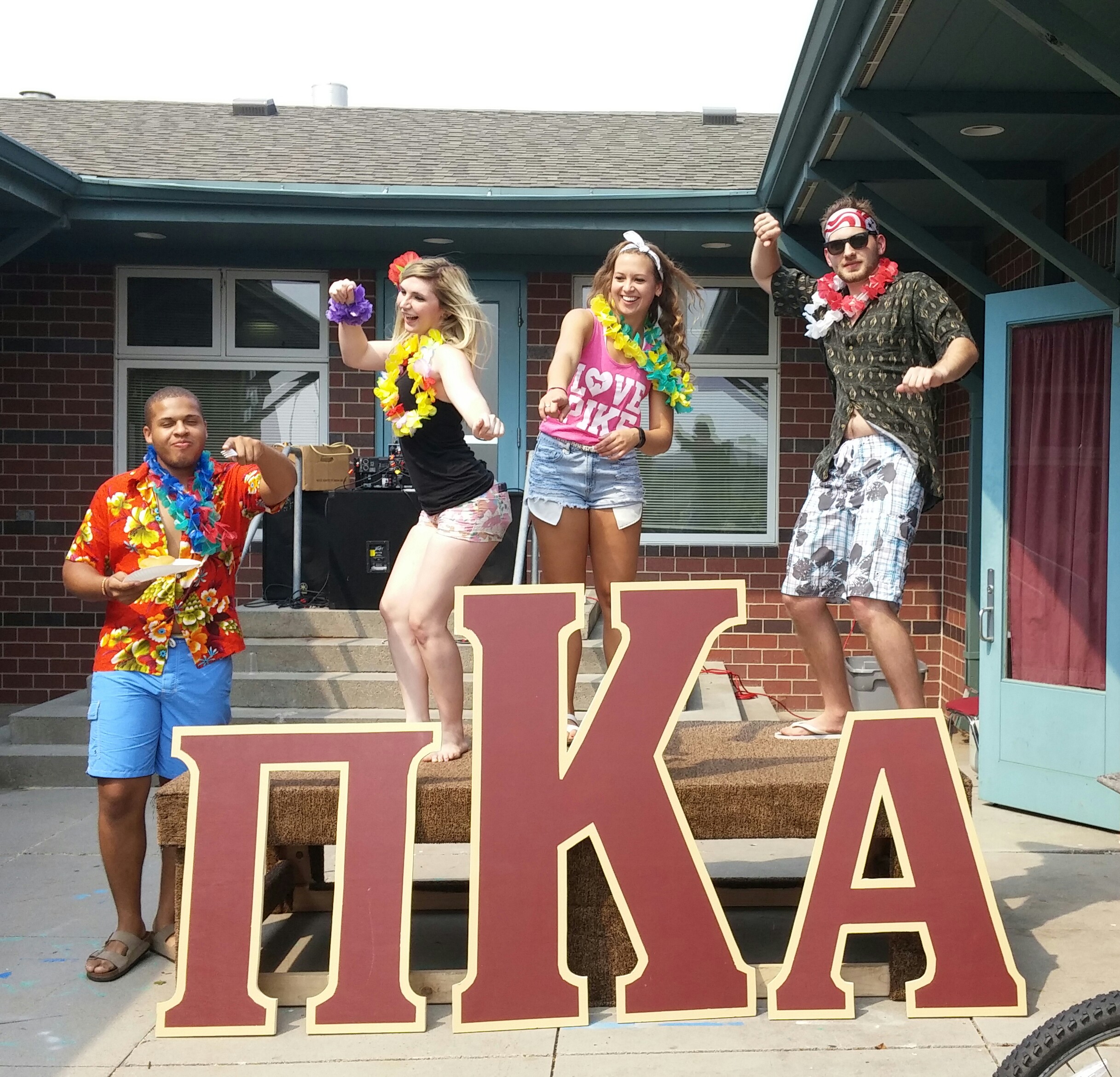 Four Unidentified Individuals At An Iota Gamma Social Event Photograph