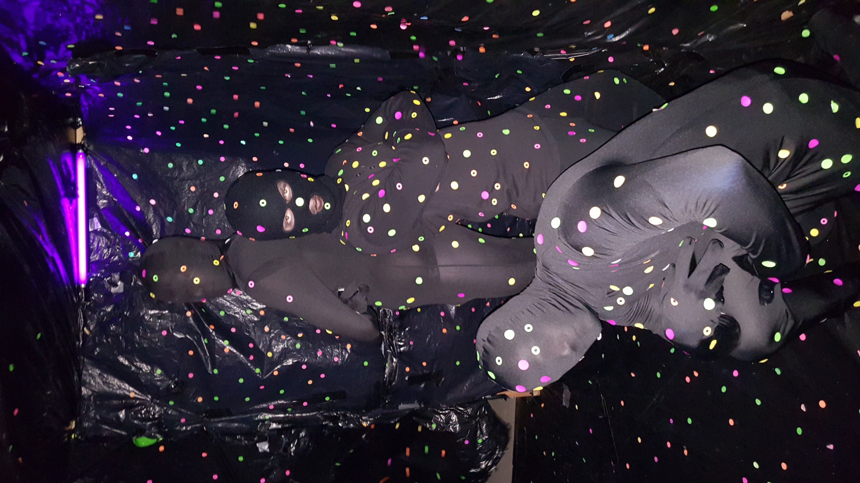 Three Unidentified Iota Gamma Pikes in Black Morph Suits Photograph