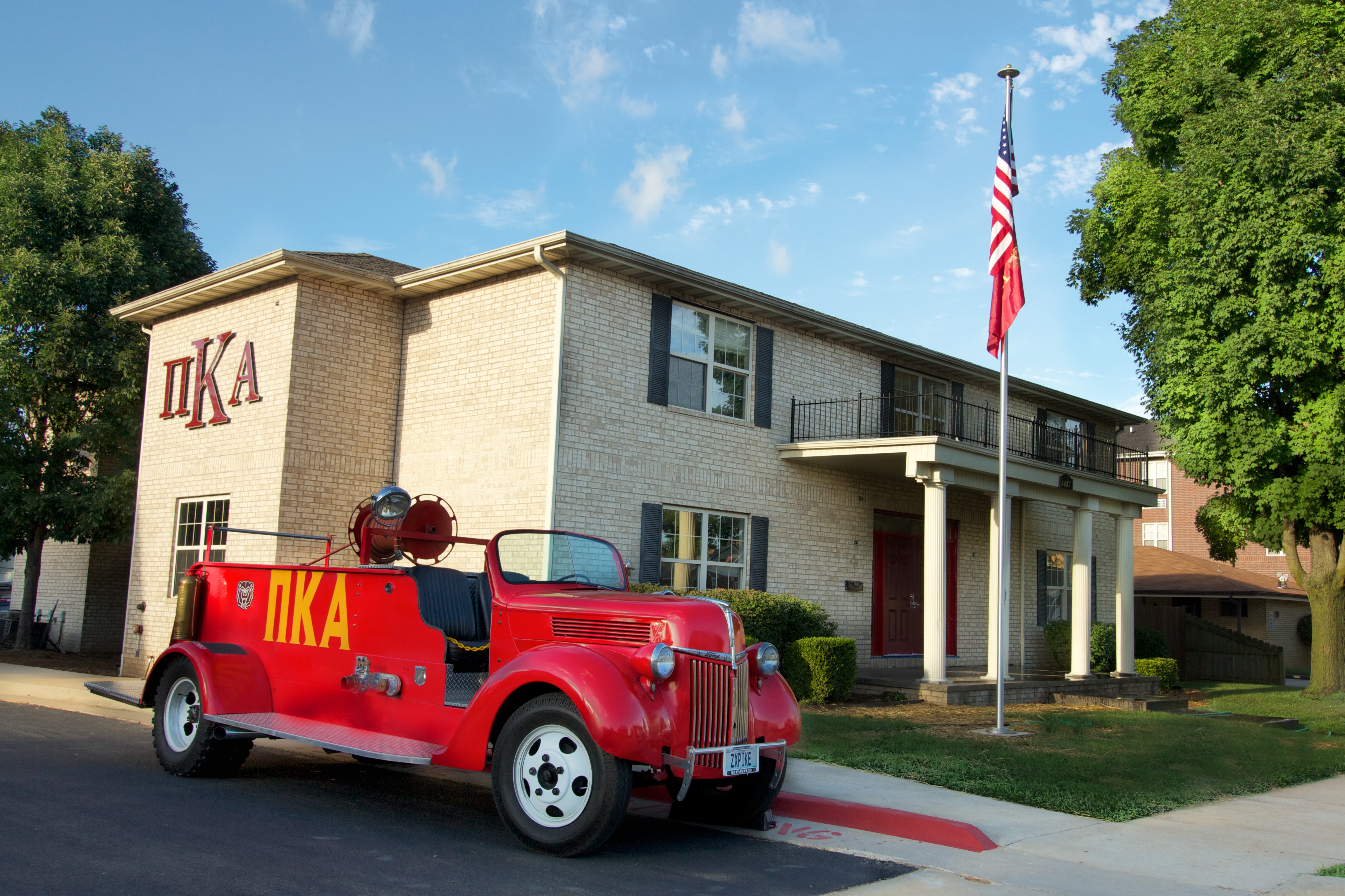 New Zeta Chi Chapter House and Chapter Fire Truck Photograph