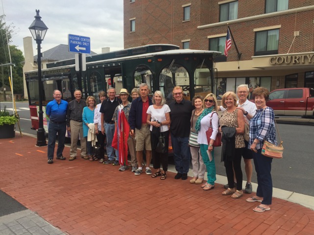 Zeta Beta Alumni and Partners In Front Of A Trolley Photograph