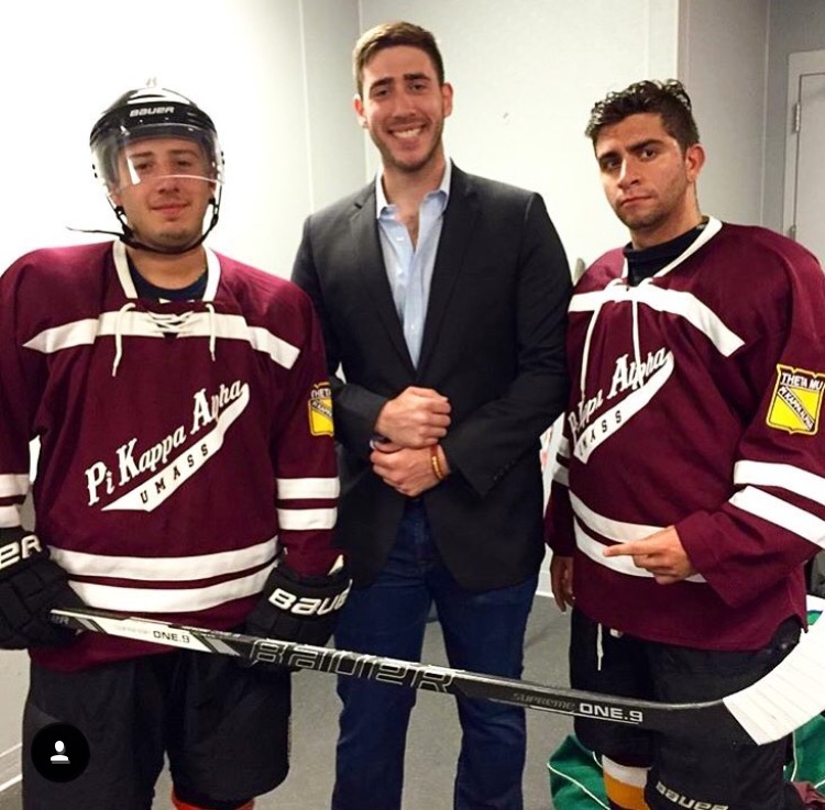 Three Unidentified Theta Mu Chapter Members At A Hockey Game Photograph