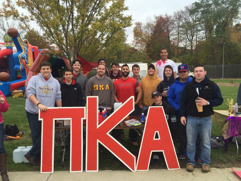 Fourteen Mu Xi Pikes Table At an Outdoor Event Photograph
