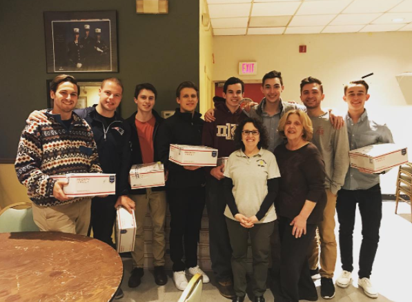 Eight Lambda Nu Chapter Members With Packages Photograph