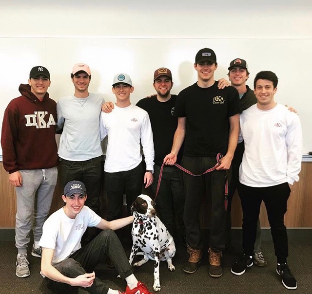 Eight Lambda Nu Chapter Members with a Dalmation Photograph