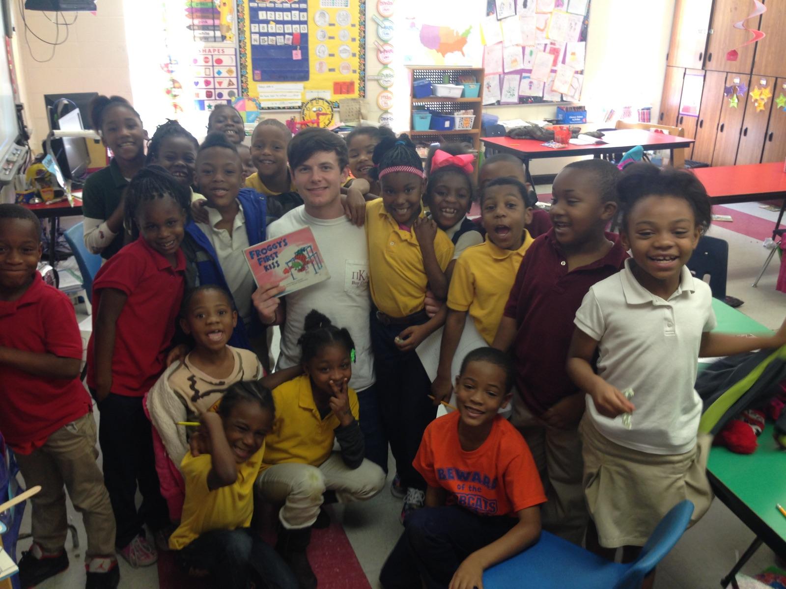 An Unidentified Eta Omicron Chapter Member Reads To A Classroom Photograph