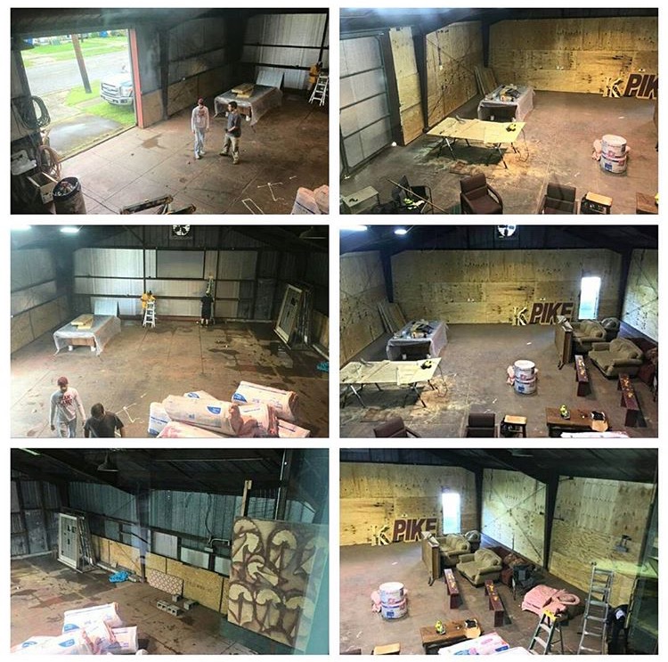 Two Zeta Omega Chapter Members in a Large Garage Photograph