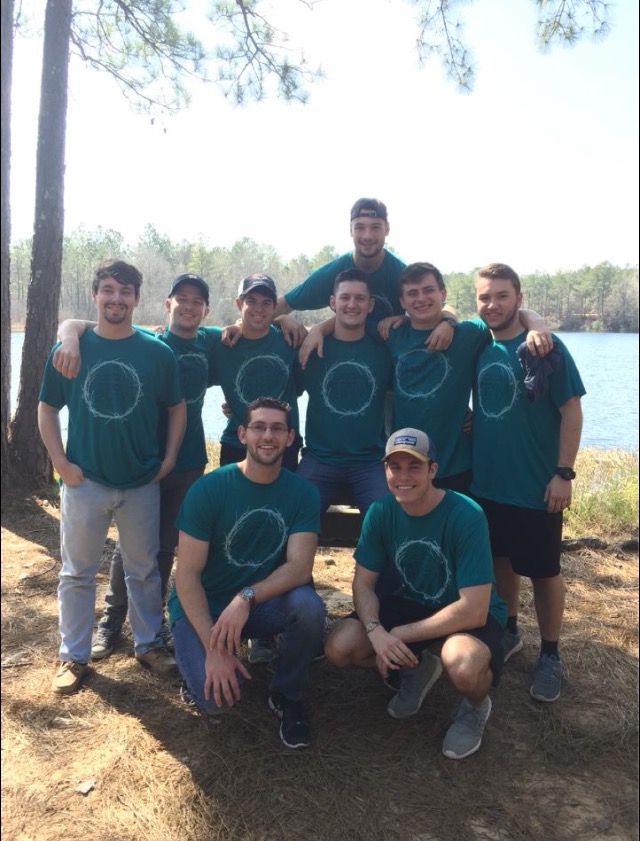 Nine Zeta Omega Chapter Members Wearing Matching T-Shirts Photograph