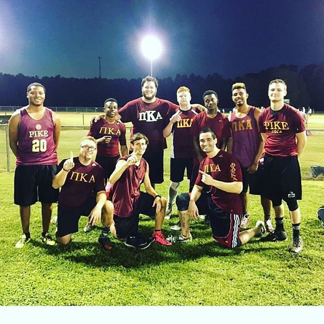 Ten Mu Kappa Chapter Members Playing A Sport Photograph