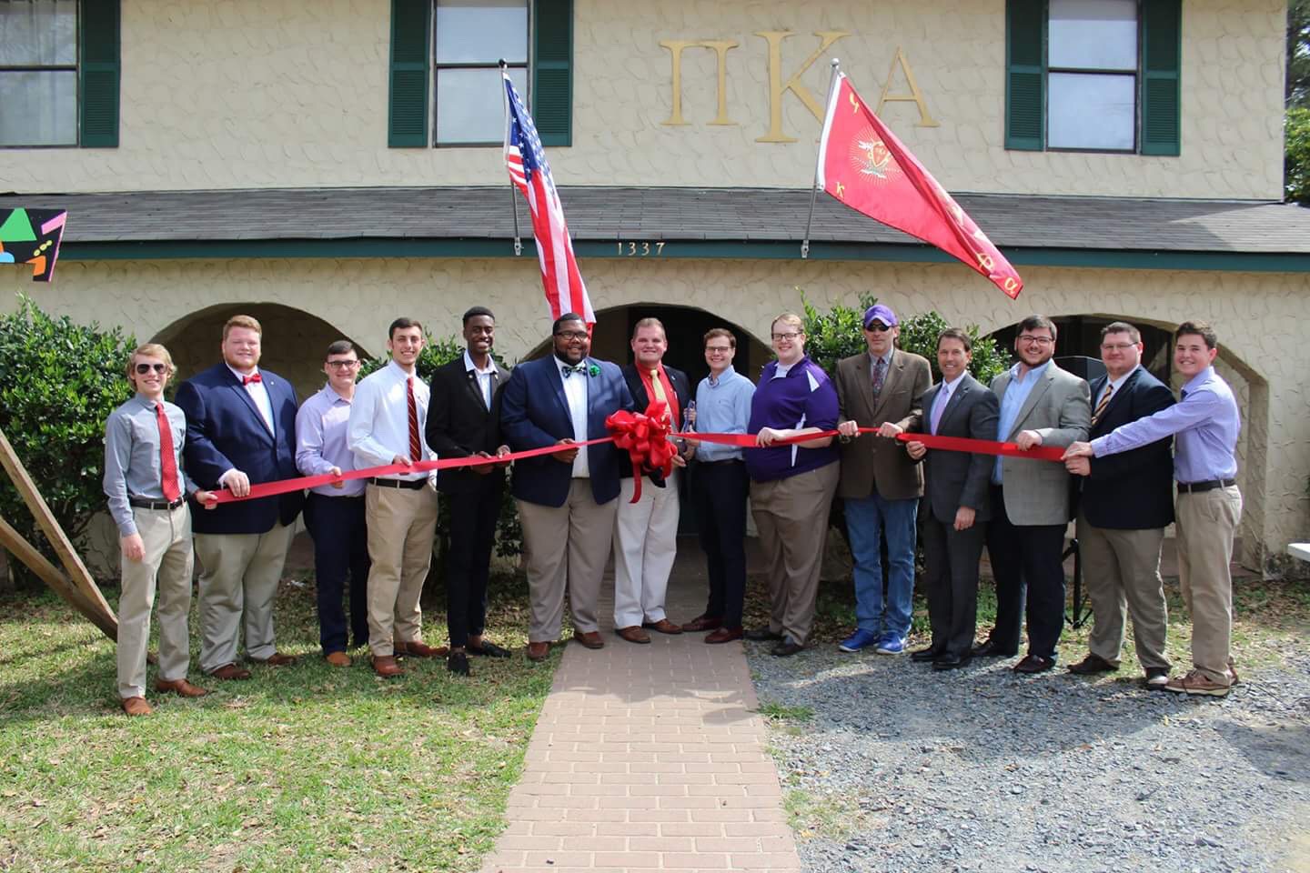Mu Kappa Chapter Members At A Ribbon-Cutting Ceremony Photograph