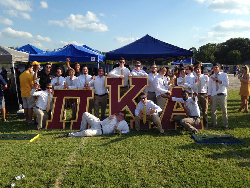 Lambda Epsilon Chapter Members With Giant Greek Letters Photograph