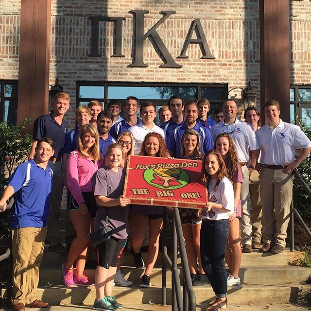 Gamma Psi Chapter Members and Others With Giant Pizza Box Photograph