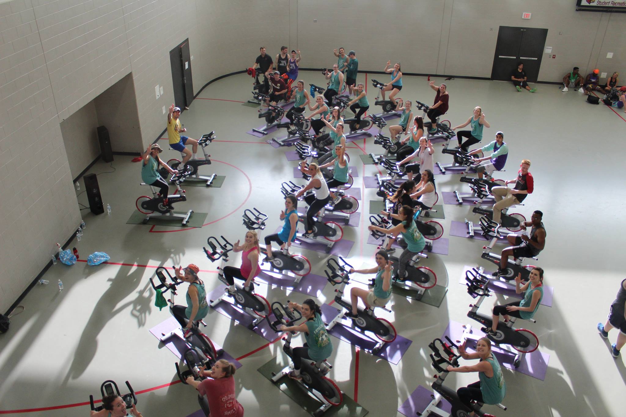 Kappa Zeta Chapter Members Leading A Spin Class Photograph