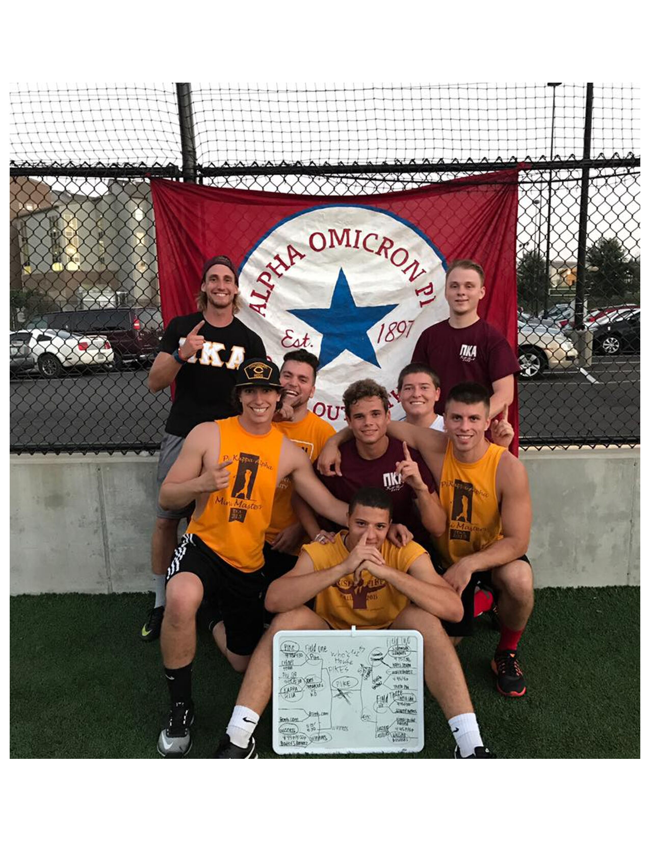 Eight Eta Rho Chapter Members With An Alpha Omicron Pi Flag Photograph