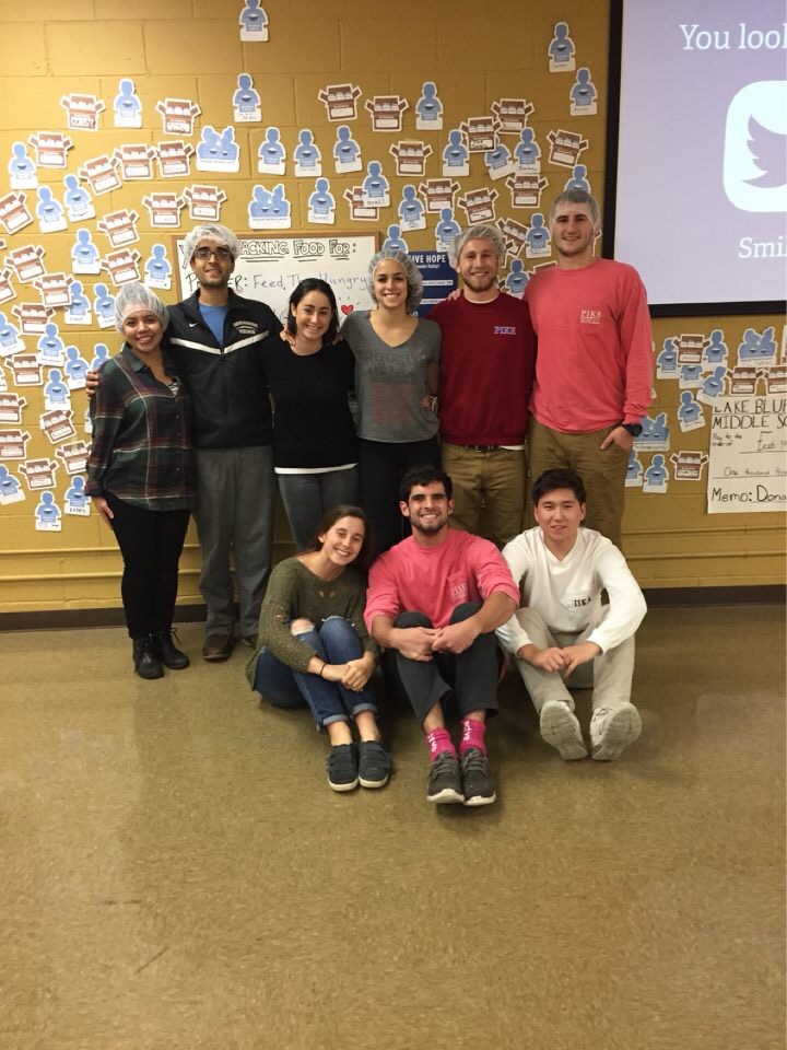 Gamma Rho Pikes Participating in a Food Drive Photograph